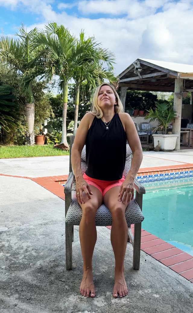 Seated Shoulder Rolls standing stretch